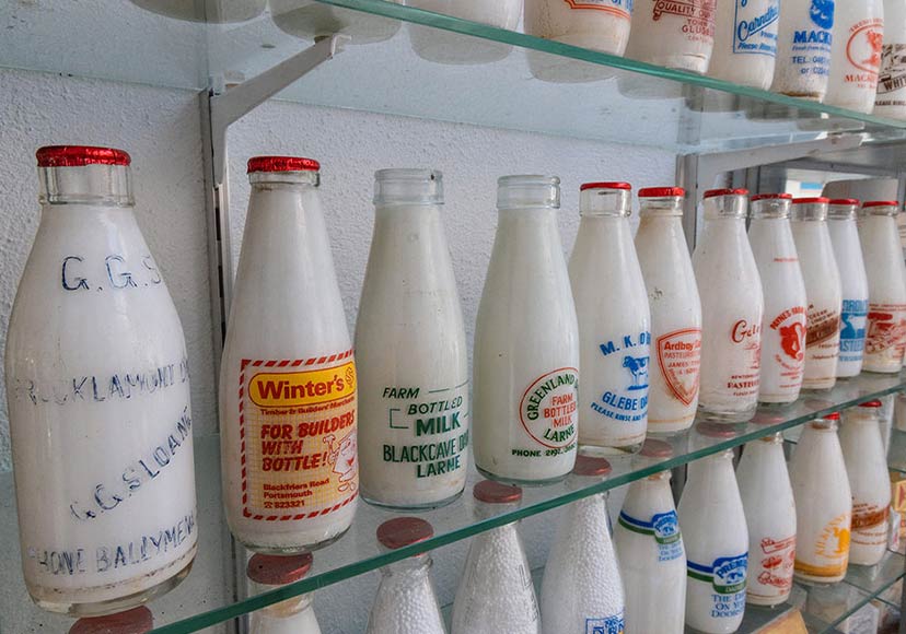 Various old milk bottles from ireland's past.
